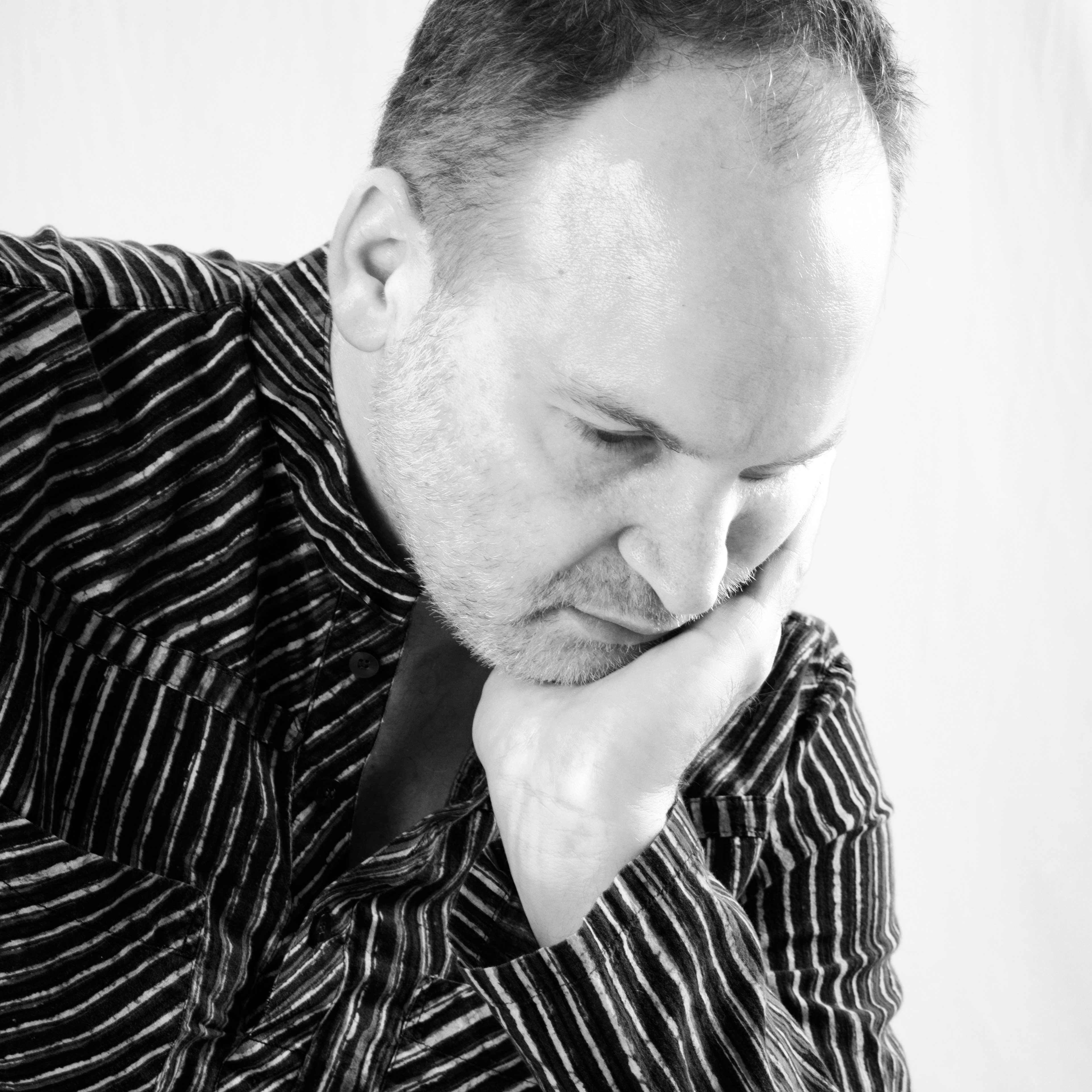 Jason Scholder - Blue Shirt - Thinking - Black and White